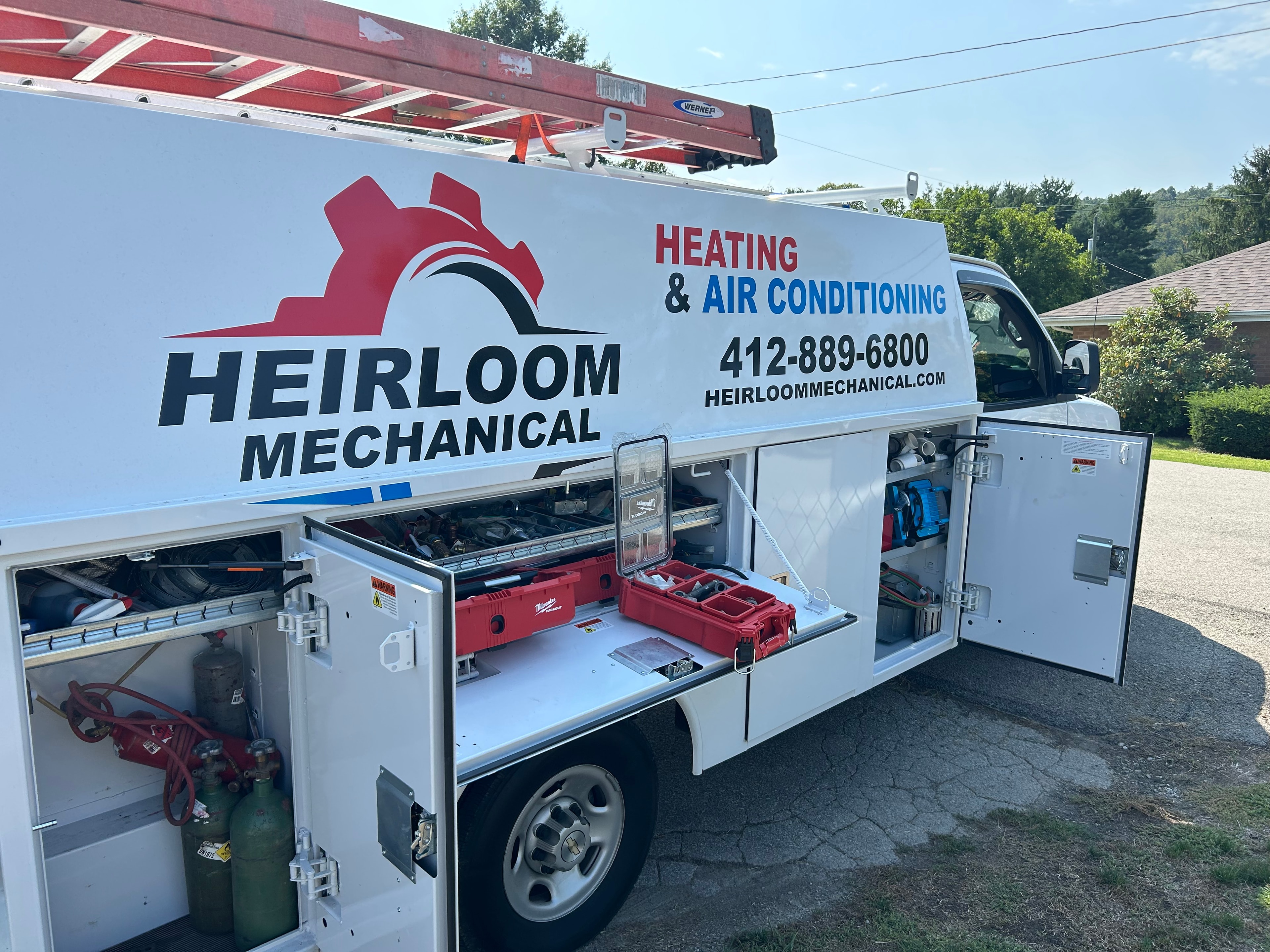 Heirloom Mechanical service truck stocked with HVAC tools and equipment at a Connellsville, PA installation job