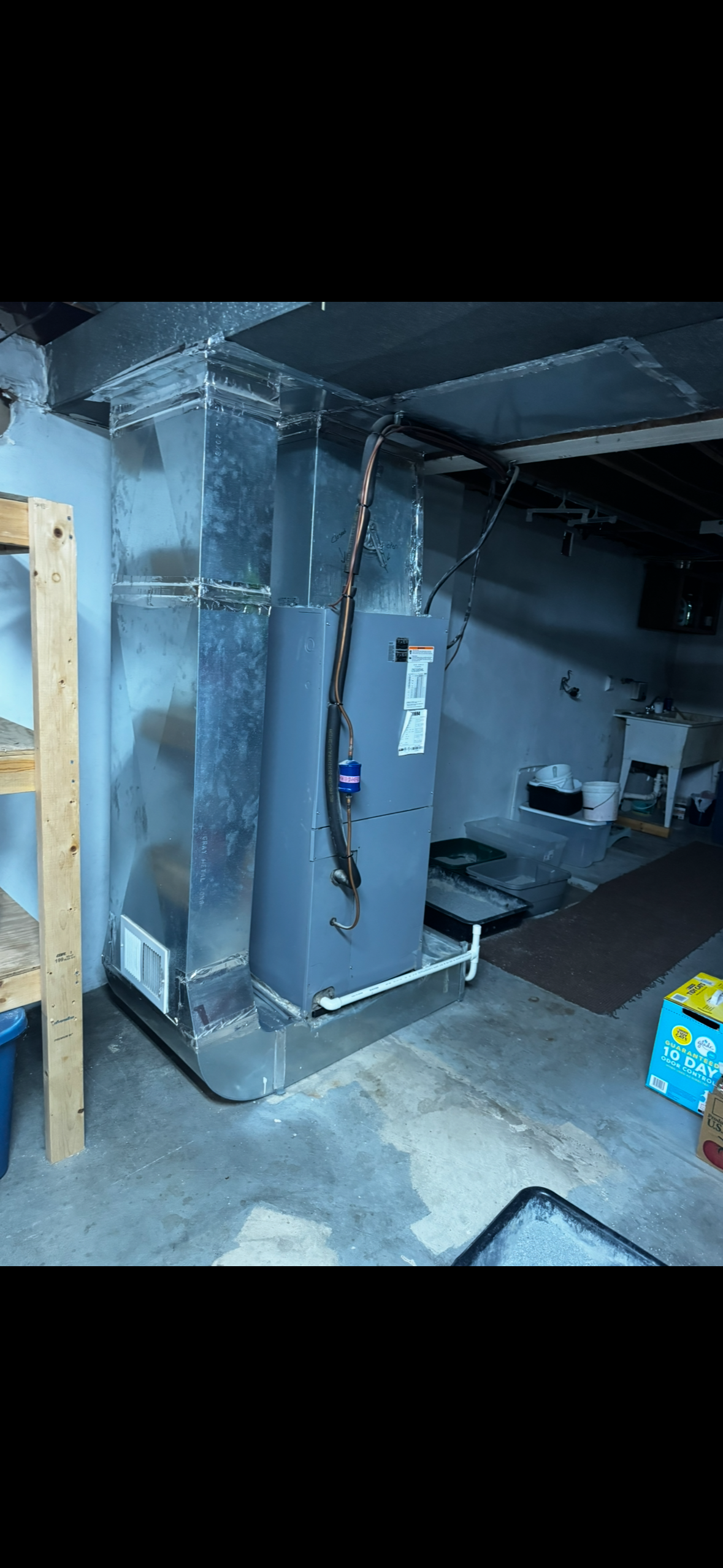 Old furnace unit in Dawson, PA home basement before HVAC upgrade by Heirloom Mechanical