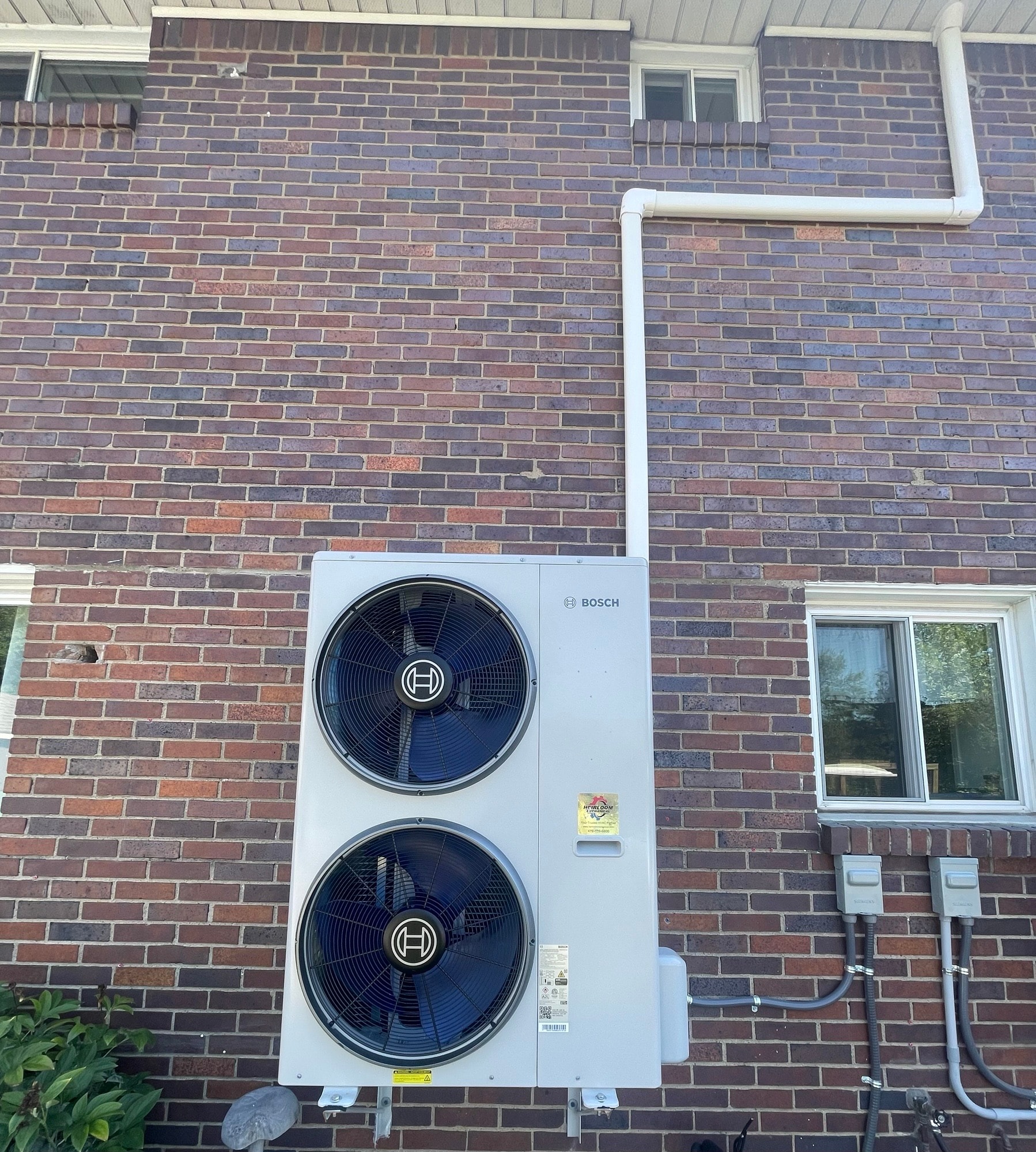 Bosch IDS Edge inverter ducted split heat pump outdoor unit installed on brick exterior — Liberty, PA near Glassport, Allegheny County