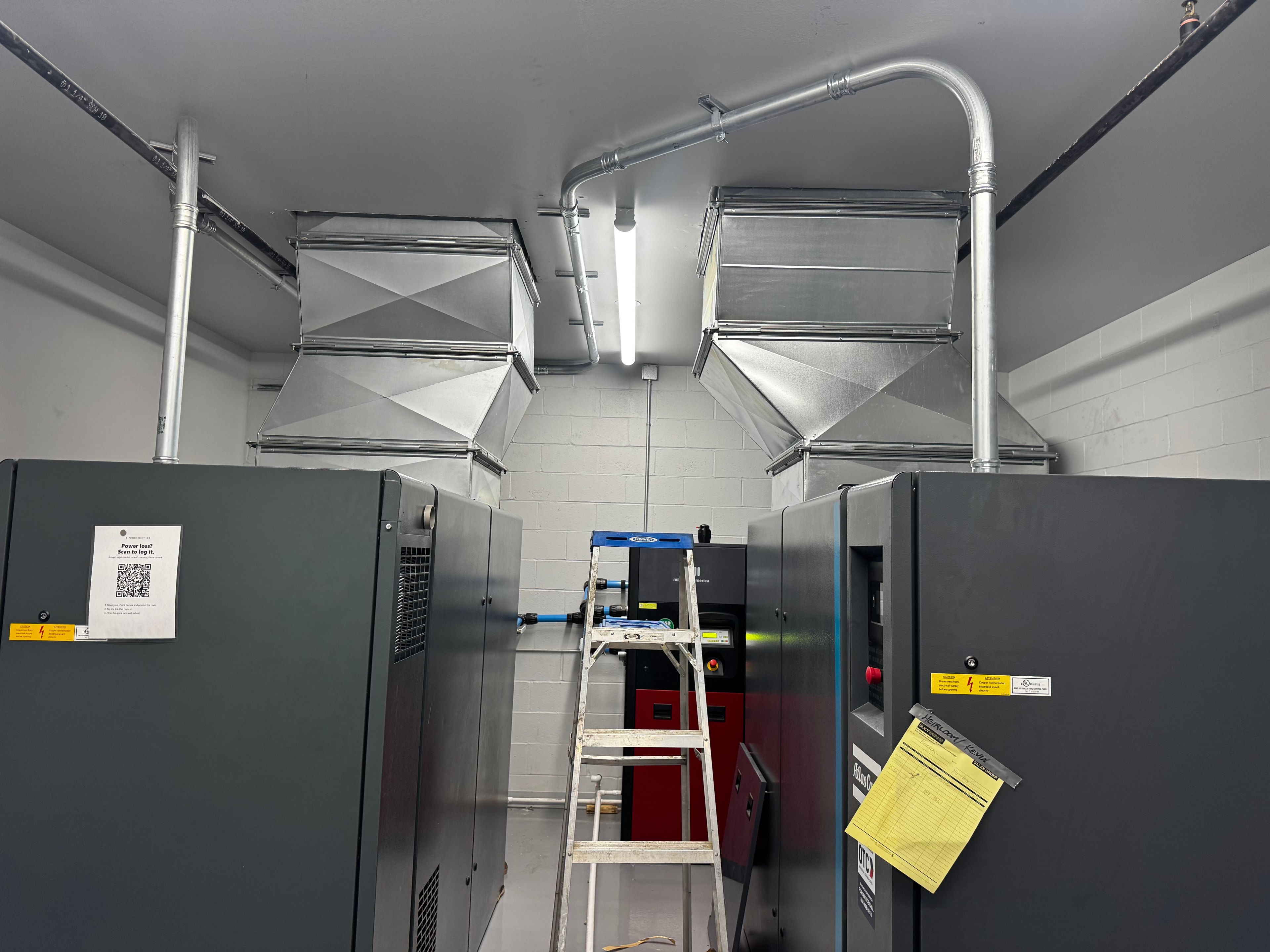 Custom sheet metal ventilation hoods installed over industrial air compressor equipment in commercial facility — Monroeville, PA